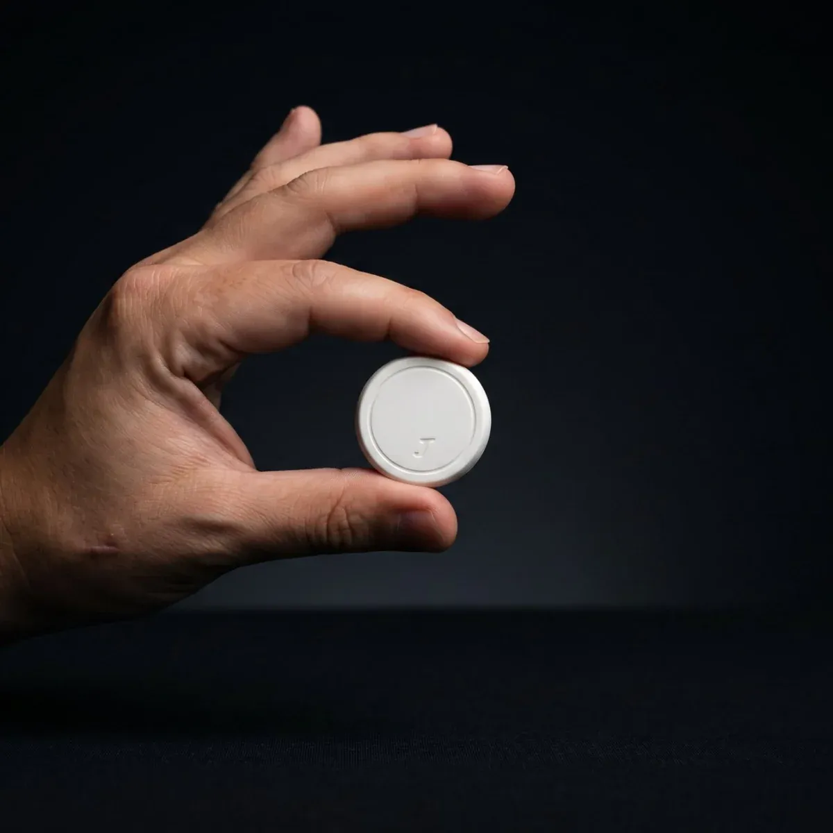 The JawSense ONE sensor held in a hand